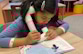 girl reading book out loud for herself