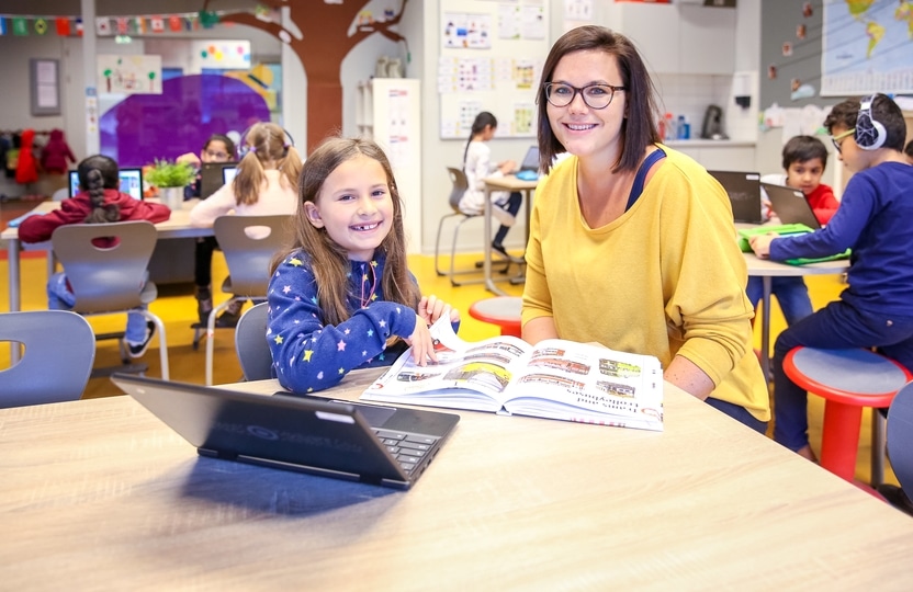 teacher and student working together in the classroom